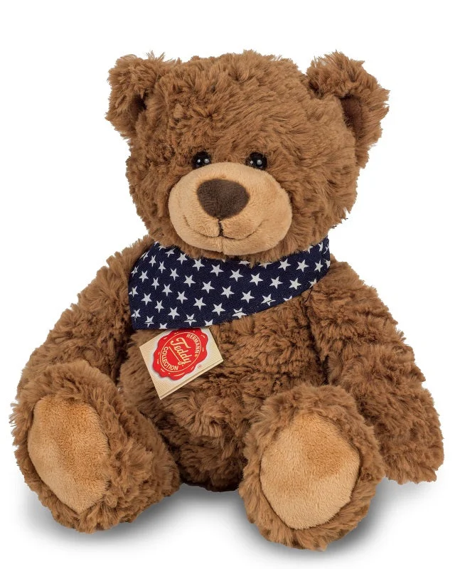 Brown teddy bear with star print scarf by Teddy Hermann